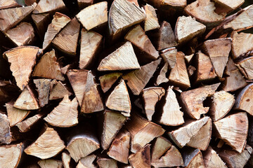 Texture of chopped wood. Wood for burning in the stove or fireplace. Pile of wood pieces background.