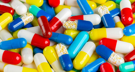 Background of pills in white, blue and other colors. Pills.