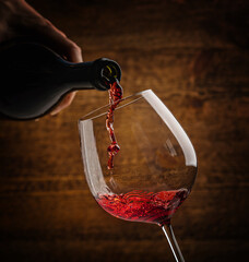 Pouring red wine