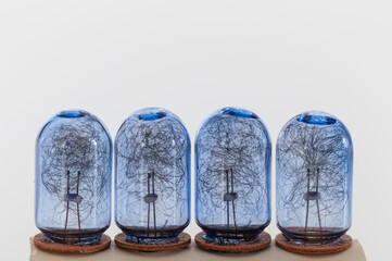 four unused old flash bulbs