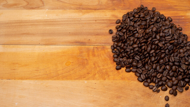 Coffee Beans on the side on a Wood Board
