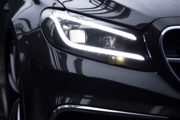 Obraz na płótnie Canvas Car headlights, Exterior closeup detail, Car detail