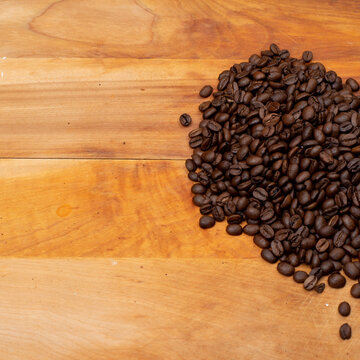 Coffee Beans on the side on a Wood Board