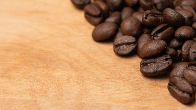Coffee Beans on the side on a Wood Board