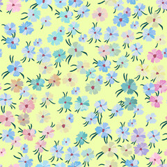 Vector seamless pattern with lots of small flowers of different colors on a light green background.