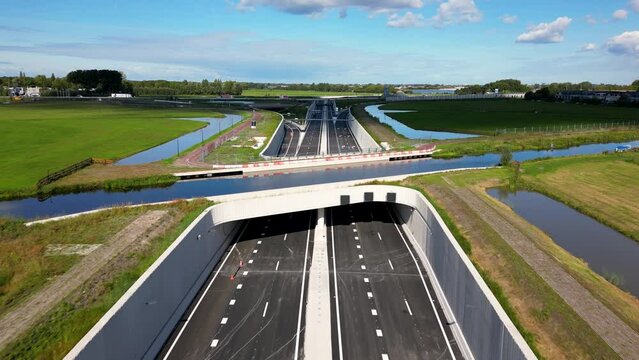 This aerial drone video shows an highway which is being build in the Netherlands. The highway connects the A4 with the A44 near Leiden.