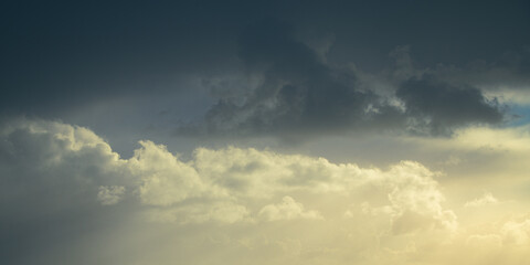 Obraz premium Thick gray clouds cover the sky, background. Cloudscape. Panoramic image. The vast clouds sky.