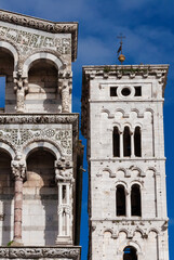 Fototapeta premium Medieval architecture in Lucca. Partial view of St Michael in Foro church with bell tower