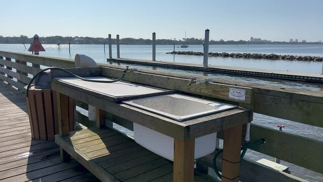 05.22.2023 Ormond Beach, FL. USA Filet table at dock on Halifax River