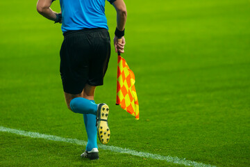 Assistant of football referee standing on the field