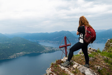 Trekking scene on Lake Como alps in spring - 604954195