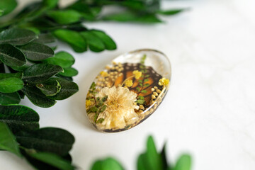 Real flowers in epoxy resin, jewelry