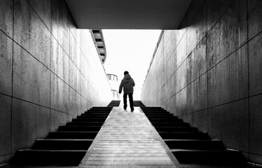 Men walking on the stairs of the underground