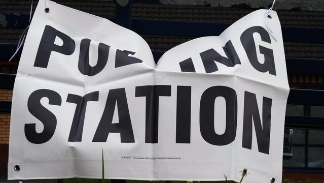 Polling Station sign in Britain in the breeze