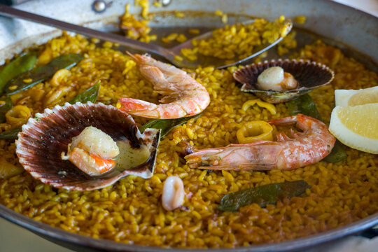 Seafood paella with shrimps and san jaques or scallops Spain