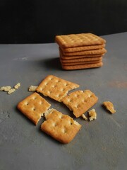 cream cracker biscuit on black background