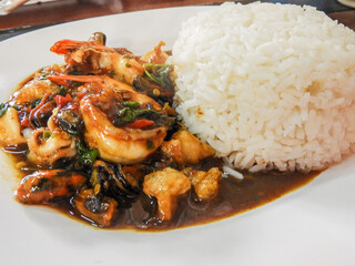 Fried rice with seafood and basil is a delicious and flavorful dish that combines the freshness of seafood with the aromatic taste of basil. The combination of succulent shrimp, tender squid, plump.