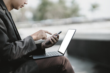 Employees fired or resigned from the company are using their mobile phones to find a jobs and schedule an interview..Unemployed, hiring job, quitting job concept.