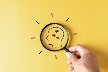 Magnifier focus to Human Brain white jigsaw puzzle, mental health, creative thinking, idea ,...