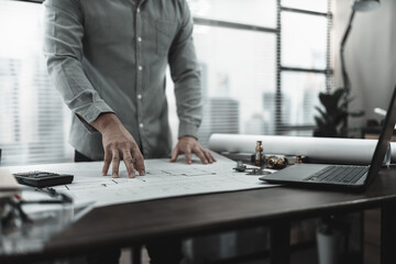 Architect engineer read drawing design working on blueprint. House planning design and construction concept.