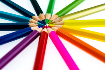 Color pencils make a circle on white background