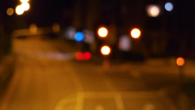blurred bokeh footage of night city street traffic 