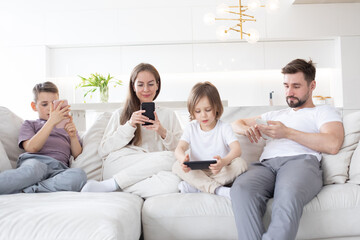 Fototapeta premium Family with smartphones at home