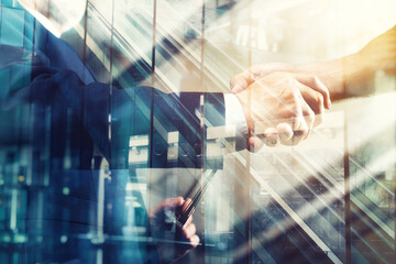 Team of workers reaches an agreement. Double exposure with light effect
