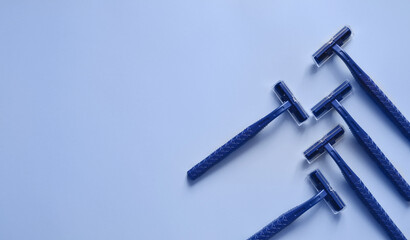 disposable machines on a blue background, hair removal, shaving and epilation, shaving machine, razor, banner, template for text