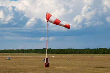 Airport wind sock. Strong wind and bad weather. Climate change. Meteorology forecast.
