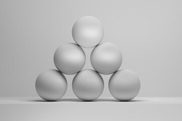 Minimalist composition of white spheres forming an abstract pyramid on a clean white background. Geometric patterns, symmetry, and balance create a modern and artistic concept. 3D RENDER.