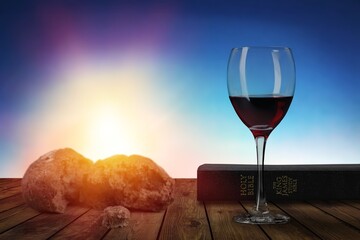 Holy bread and red wine with bible book