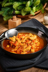 Chicken fricassee with red paprika and onion.