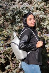 Fototapeta premium Beautiful young woman with blue eyes wearing backpack