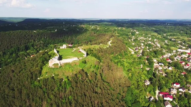 The ruins of Kremenets Castle on a hill from a bird's eye view. Location place Ukraine, Europe. Adventure vacation. Scenic image of popular european tourist attraction.