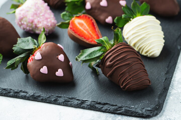 Gourmet chocolate covered strawberries on the light background
