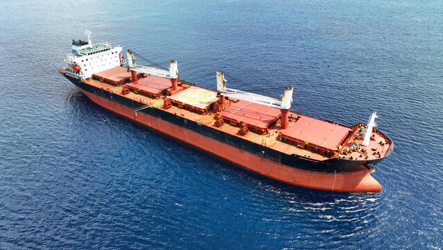 Aerial drone photo of huge bulk carrier tanker anchored in deep blue Aegean sea