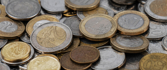 A pile of gold and silver coins.