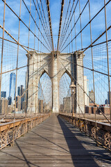 Brooklyn Bridge in New York City skyline of Manhattan with World Trade Center skyscraper portrait format in the United States