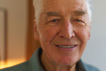 Portrait of senior man at his home.