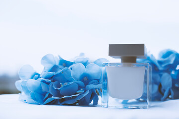 White perfume and blue flowers