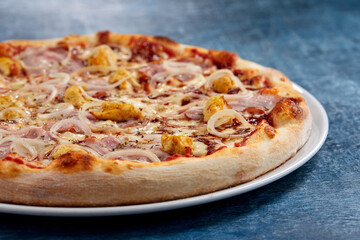 tasty pizza on the wooden background