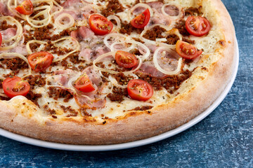 tasty pizza on the wooden background