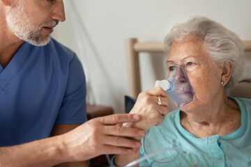 Portrait of senior woman with inhaller, healthcare concept.