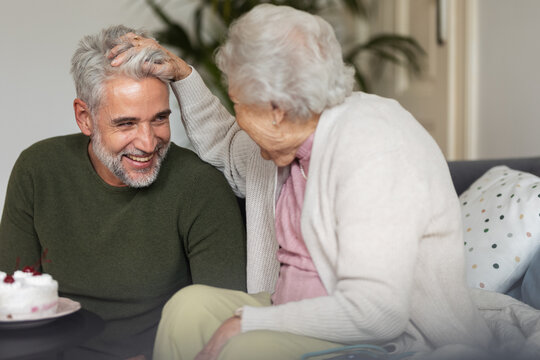 Adult man and senior woman spending quality time together.