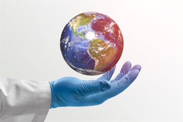 Hands of doctor hold Earth globe