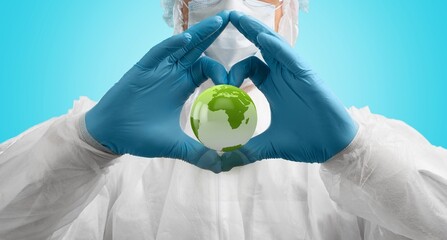 Hands of doctor hold Earth globe