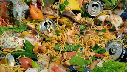 Emptying Trash Into Dumpster Closeup