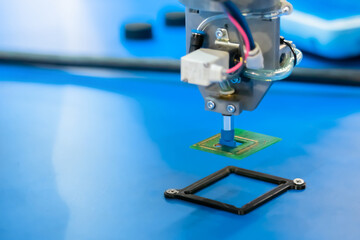 Pick and place robotic arm manipulator during work at modern robot exhibition, trade show, factory,...