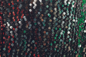 Sequins close-up macro. Abstract background with sequins colorful on the fabric.